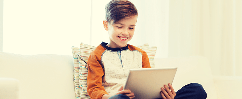 What Kids Say About Connected Toys, Apps Kid on tablet using app