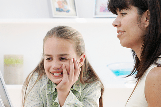 Mom with daughter on computer