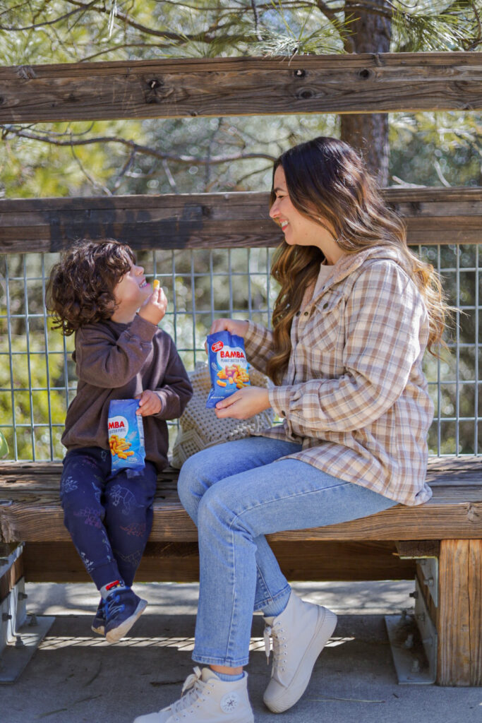 Mom-influencer sharing Bamba peanut butter puffs with her audience.