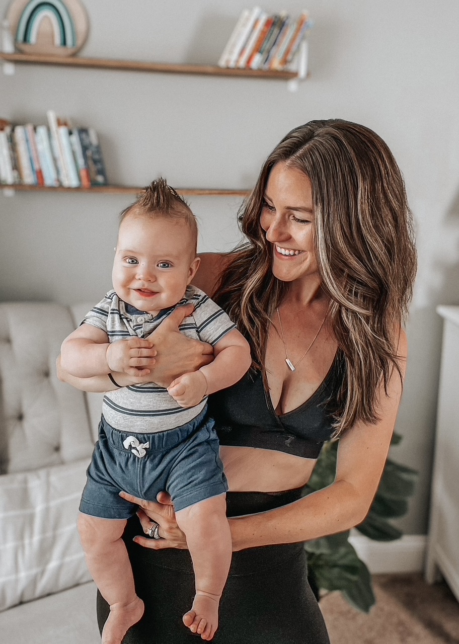 Blog – Gen Z Mom and baby Gen Z parent cradling her happy infant—an authentic image of modern motherhood for brands targeting Gen Z moms.