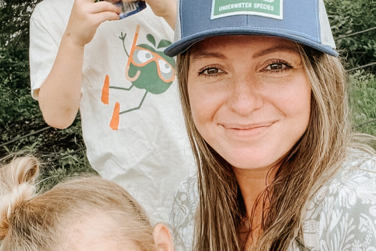 Gen Z mom walking in the park with two kids enjoying GoGo squeeZ applesauce pouches, representing modern parenting and consumer influence. Gen Z mom walking in the park with two kids enjoying GoGo squeeZ applesauce pouches, representing modern parenting and consumer influence.