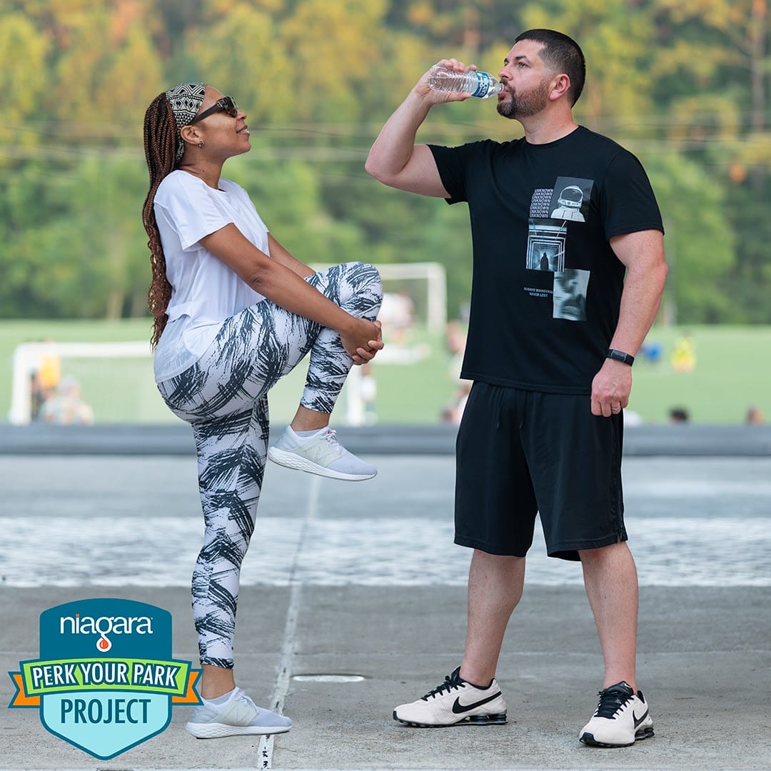 Mom brand ambassador promoting wellness with a branded water bottle during workout, reinforcing everyday product use and loyalty. Mom brand ambassador promoting wellness with a branded water bottle during workout, reinforcing everyday product use and loyalty.