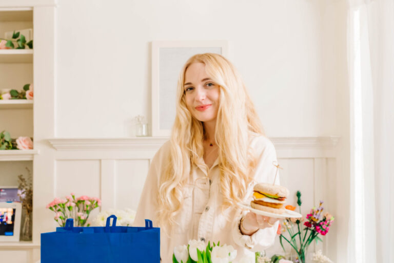 Mom influencer in kitchen displaying sponsored breakfast and Walmart shopping bag, part of a social media brand campaign. Mom influencer in kitchen displaying sponsored breakfast and Walmart shopping bag, part of a social media brand campaign.