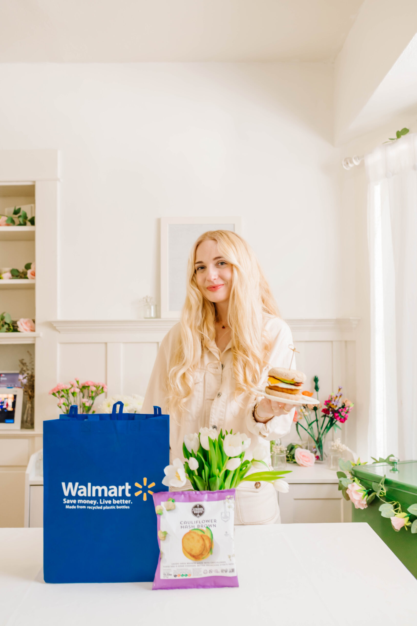 Mom influencer in kitchen displaying sponsored breakfast and Walmart shopping bag, part of a social media brand campaign. Mom influencer in kitchen displaying sponsored breakfast and Walmart shopping bag, part of a social media brand campaign.